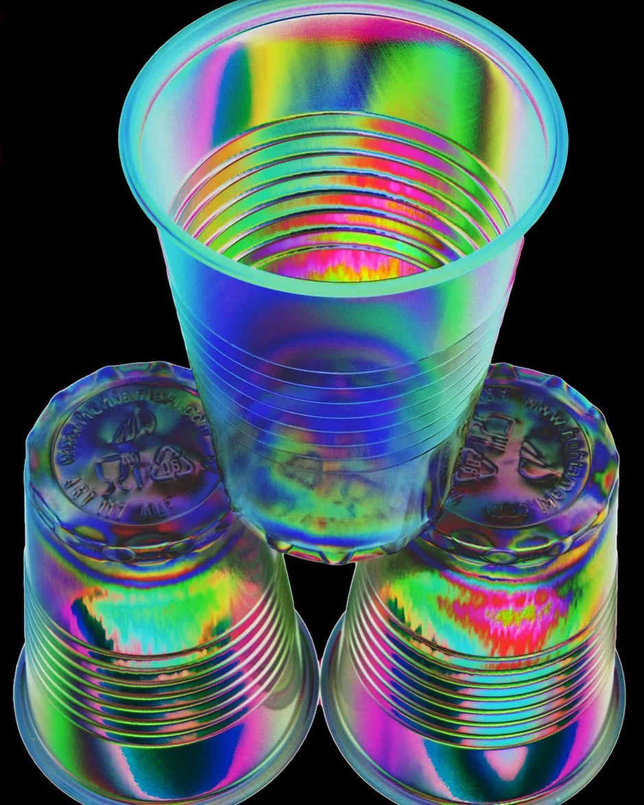 Stacked cups shot through an iridescent filter